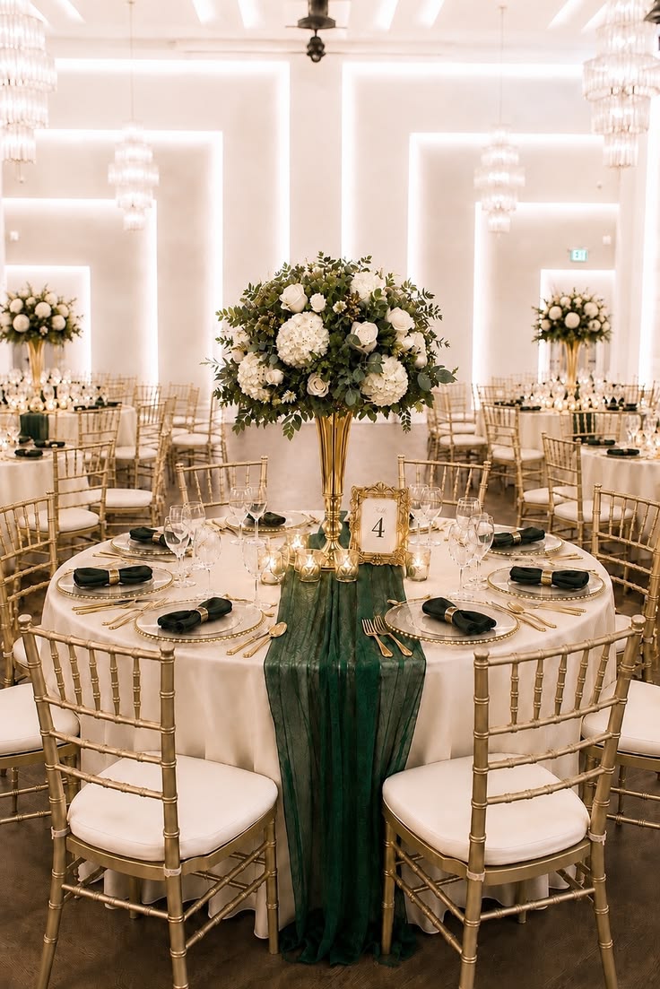 Tall floral centerpieces under chandeliers — event decor Nairobi