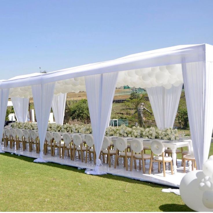 White chiavari chairs dressed with peony and greenery sashes — event decor Nairobi Eastern Bypass